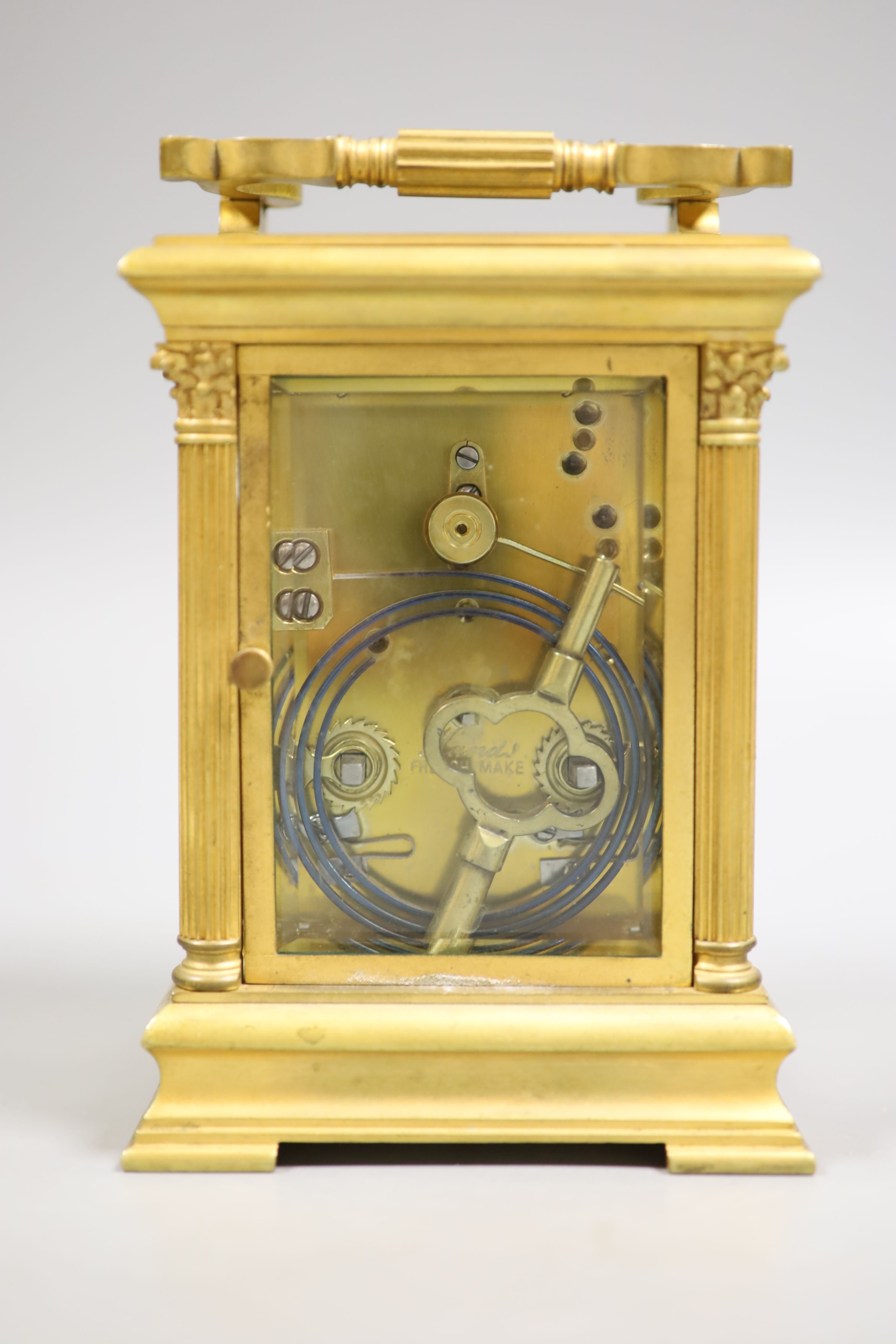 An early 20th century French brass Corinthian pattern repeating carriage clock, 19cm high handle up